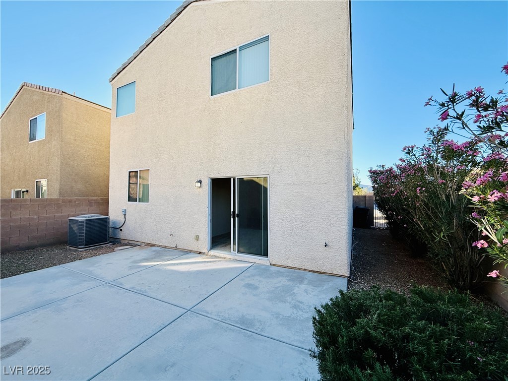 9342 Winebrook Avenue Las Vegas, NV 89148 - Photo 31 of 32 Rear view of house featuring a patio area, stucco siding, and a fenced backyard