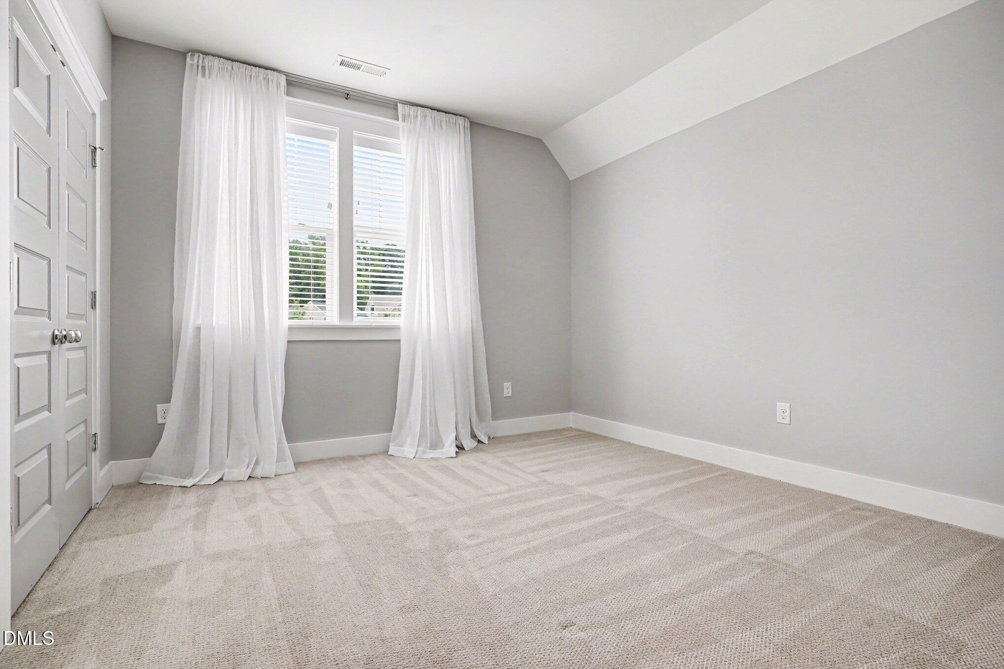 824 Watercolor Way Durham, NC 27713 - Photo 16 of 28 a view of an empty room with a window