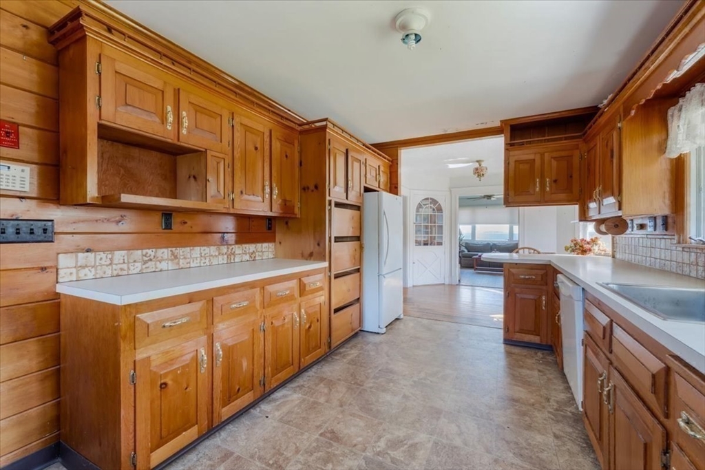 70 Hedge Road Plymouth, MA 02360 - Photo 20 of 41 a kitchen with stainless steel appliances granite countertop a sink stove and refrigerator