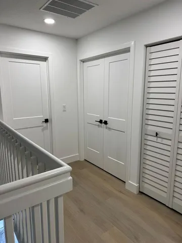 a view of entryway with wooden floor