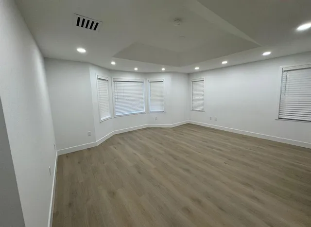 a bathroom with double vanity and a shower