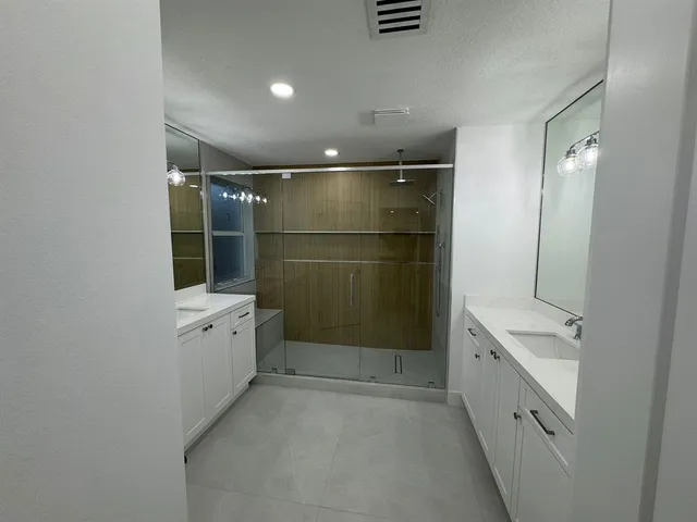a bathroom with a sink and mirror