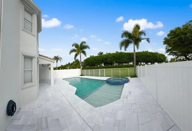 a view of a house with swimming pool