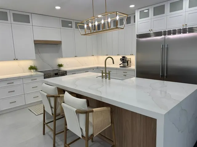 a kitchen with a table chairs sink and cabinets