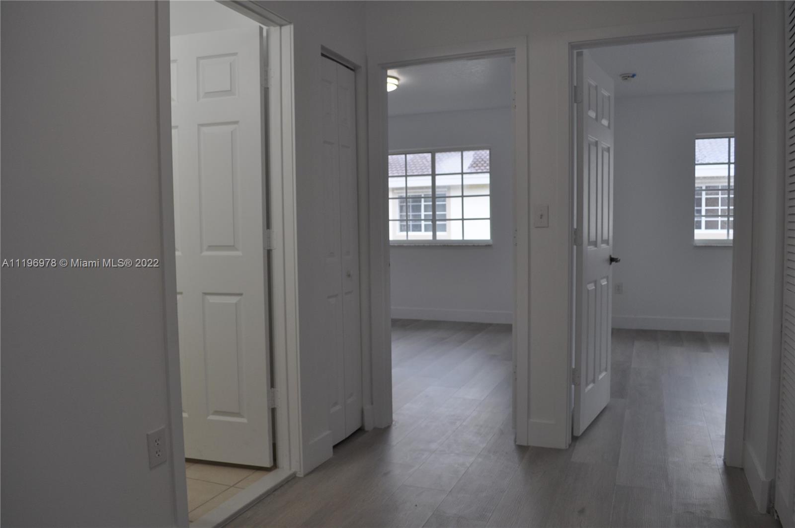 14086 Southwest 260th Street, Unit 106 Homestead, FL 33032 - Photo 14 of 26 a view of an empty room and window