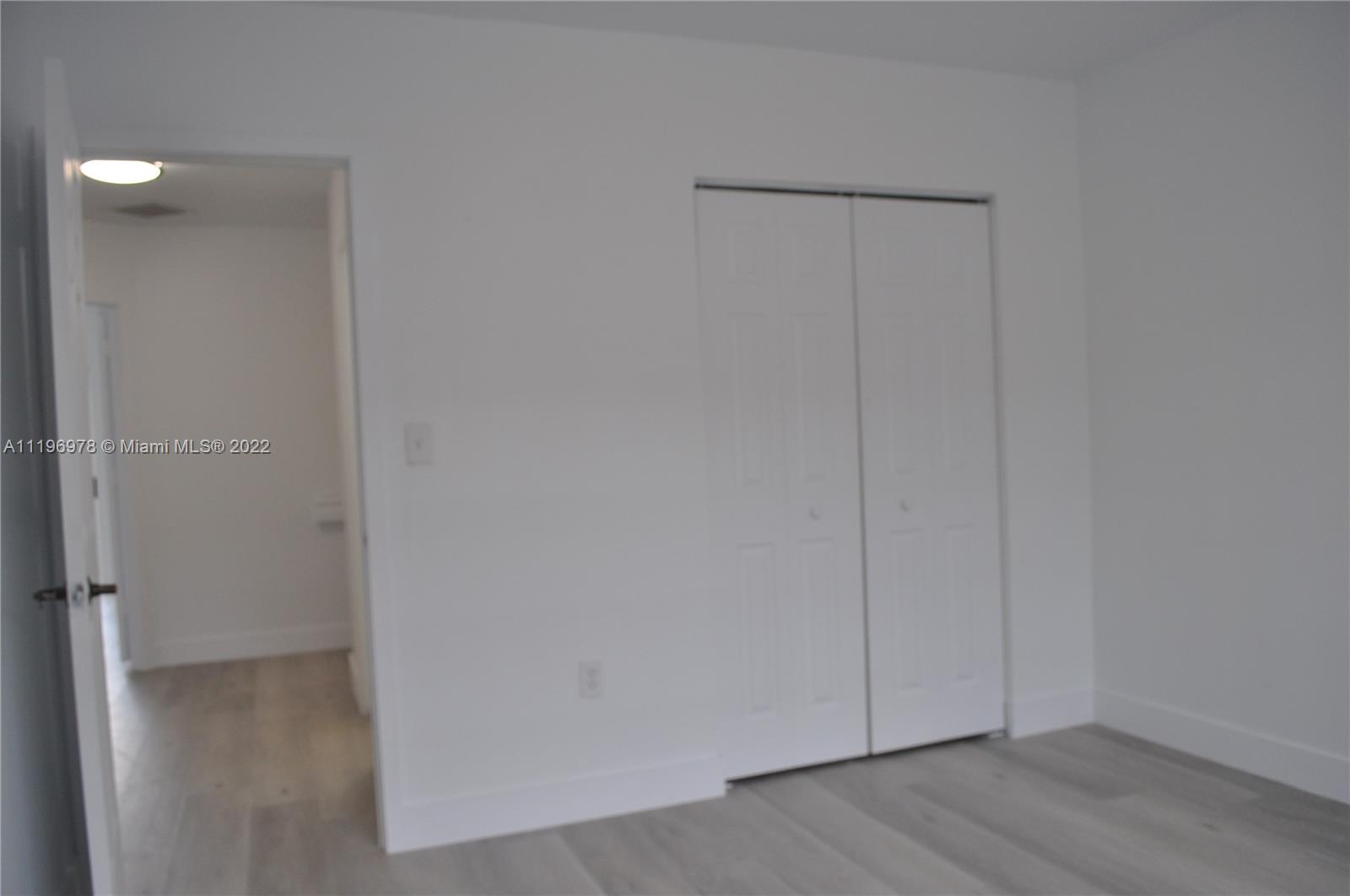 14086 Southwest 260th Street, Unit 106 Homestead, FL 33032 - Photo 17 of 26 a view of an empty room