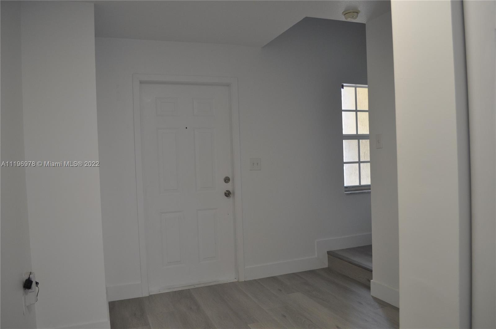 14086 Southwest 260th Street, Unit 106 Homestead, FL 33032 - Photo 2 of 26 a view of an empty room