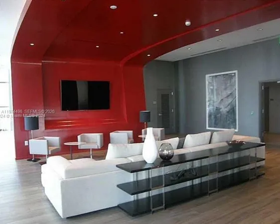 a room with pool table and windows