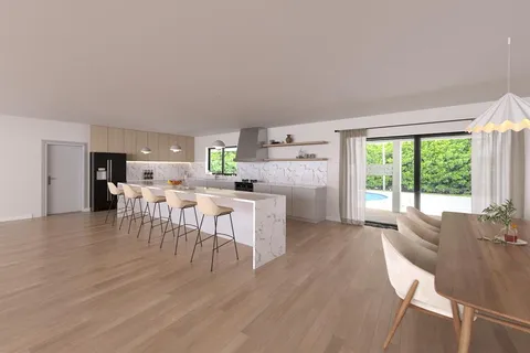 a kitchen with stainless steel appliances a dining table chairs and a wooden floor