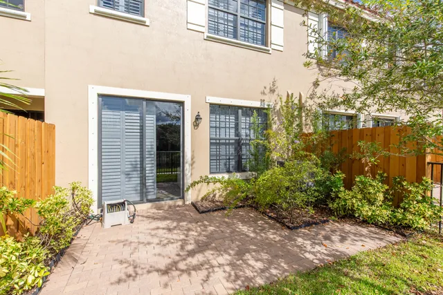 a view of a house with a yard and sitting space