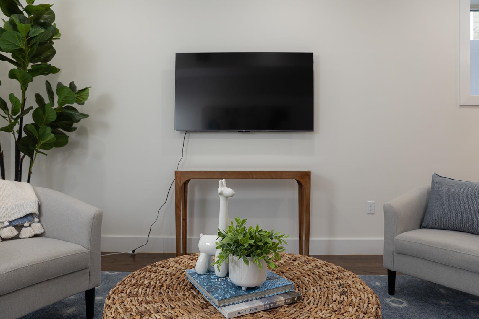 39 Boyd Avenue Jersey City, NJ 07304 - Photo 12 of 29 a living room with furniture and a flat screen tv