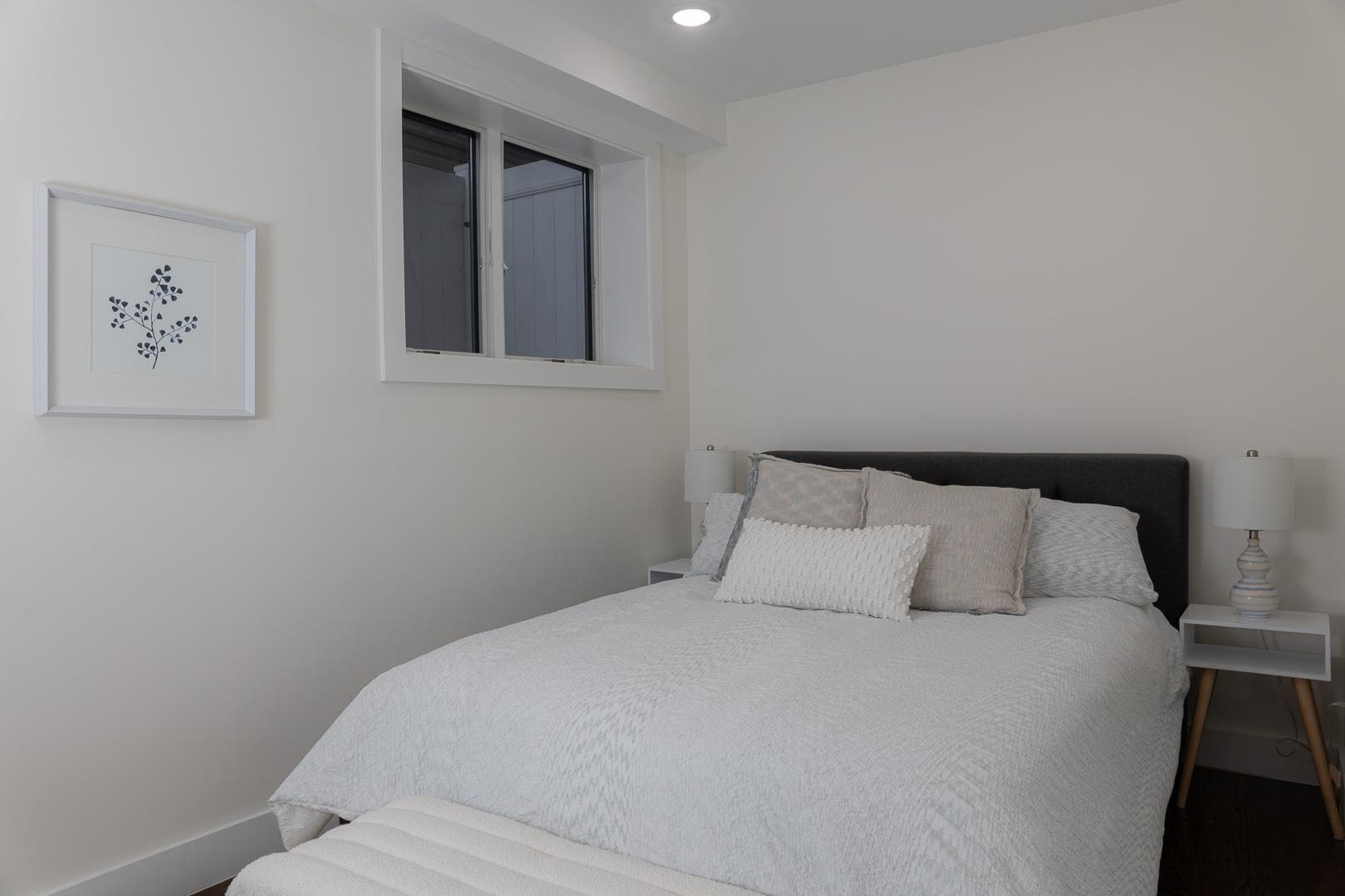 39 Boyd Avenue Jersey City, NJ 07304 - Photo 14 of 29 a bedroom with a bed and painting on the wall