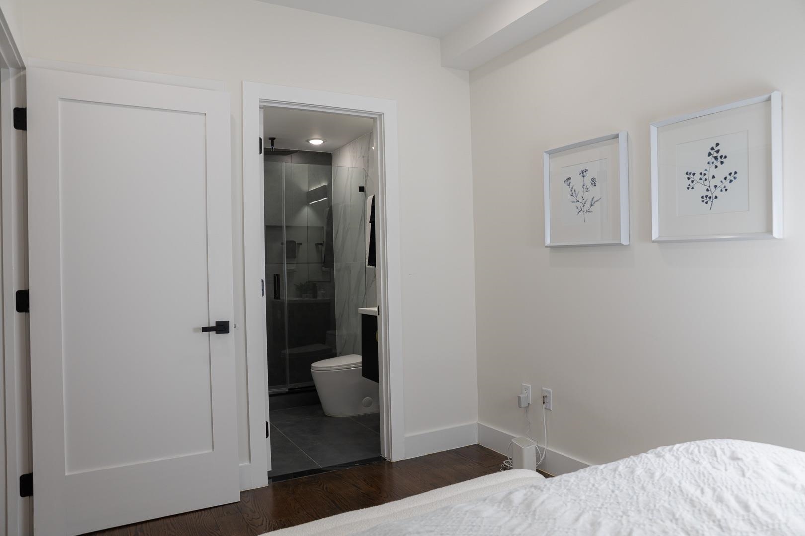 39 Boyd Avenue Jersey City, NJ 07304 - Photo 15 of 29 a bedroom with a bed and hallway