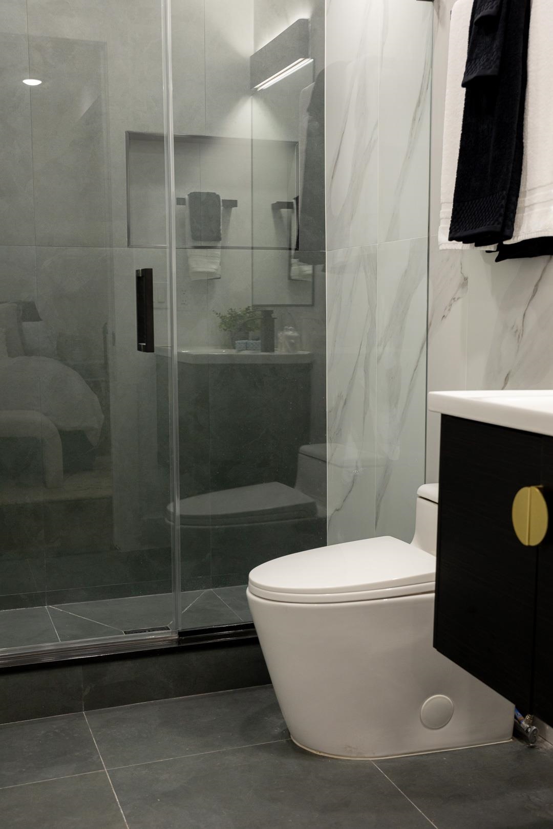 39 Boyd Avenue Jersey City, NJ 07304 - Photo 16 of 29 a white toilet sitting next to a bathtub