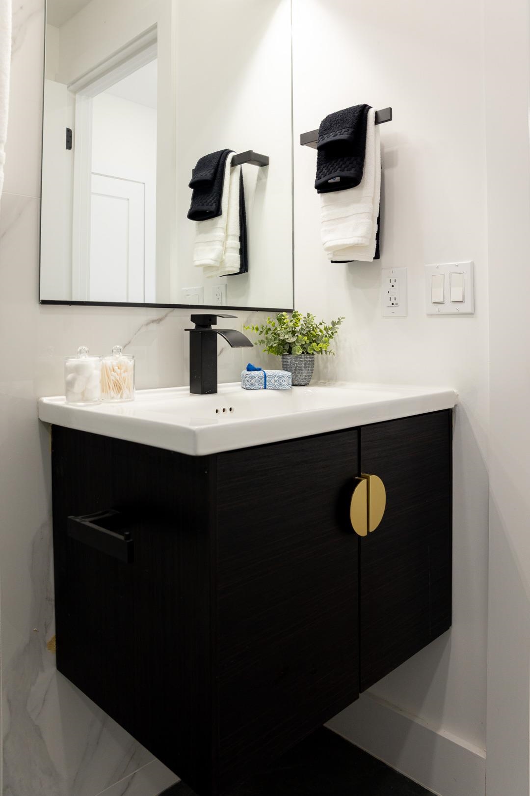 39 Boyd Avenue Jersey City, NJ 07304 - Photo 17 of 29 a bathroom with a sink and a mirror