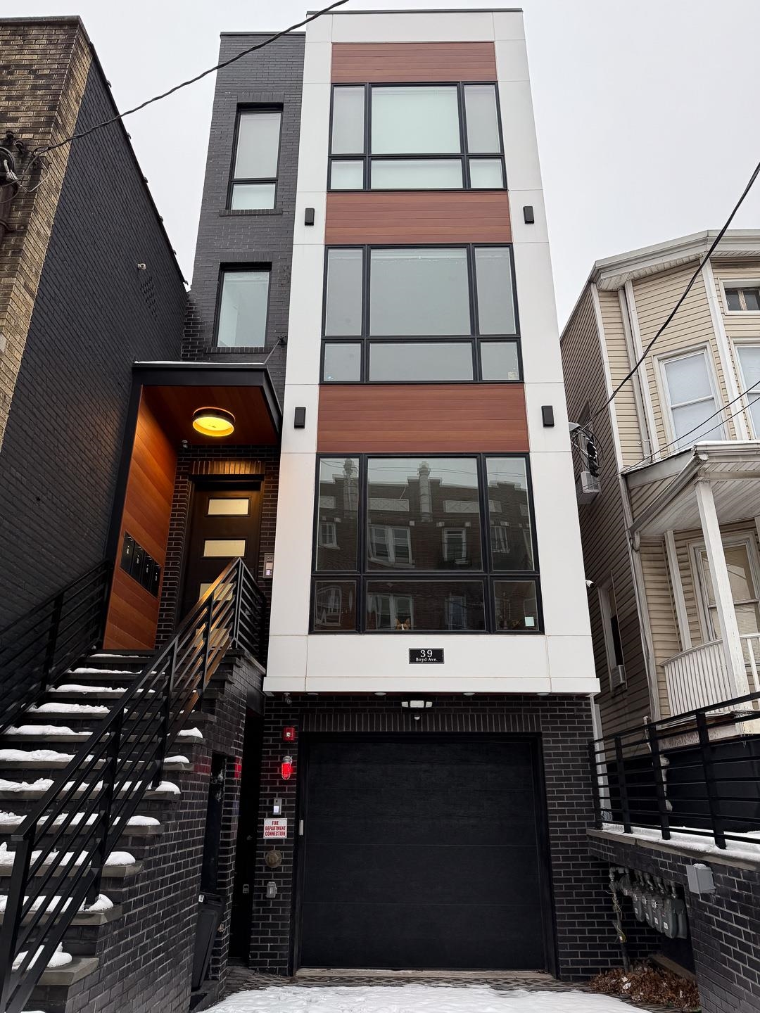 39 Boyd Avenue Jersey City, NJ 07304 - Photo 28 of 29 a view of a building with a door