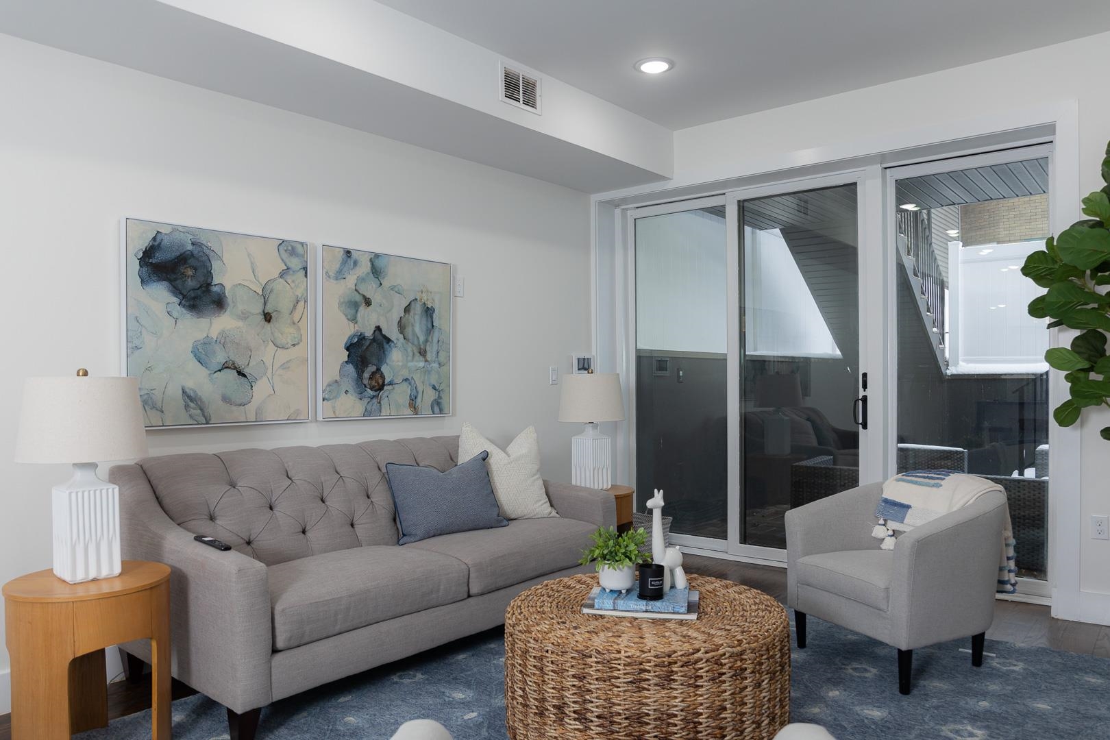39 Boyd Avenue Jersey City, NJ 07304 - Photo 7 of 29 a living room with furniture and a potted plant