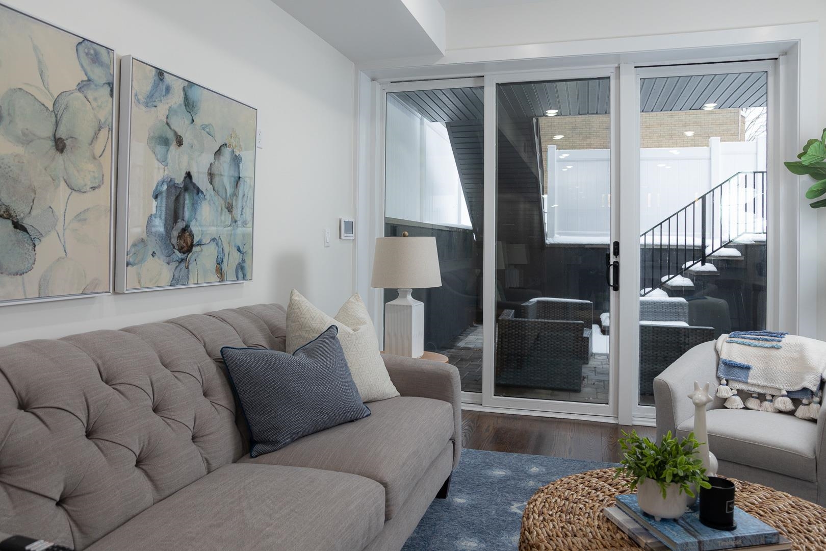 39 Boyd Avenue Jersey City, NJ 07304 - Photo 8 of 29 a living room with furniture and a large window