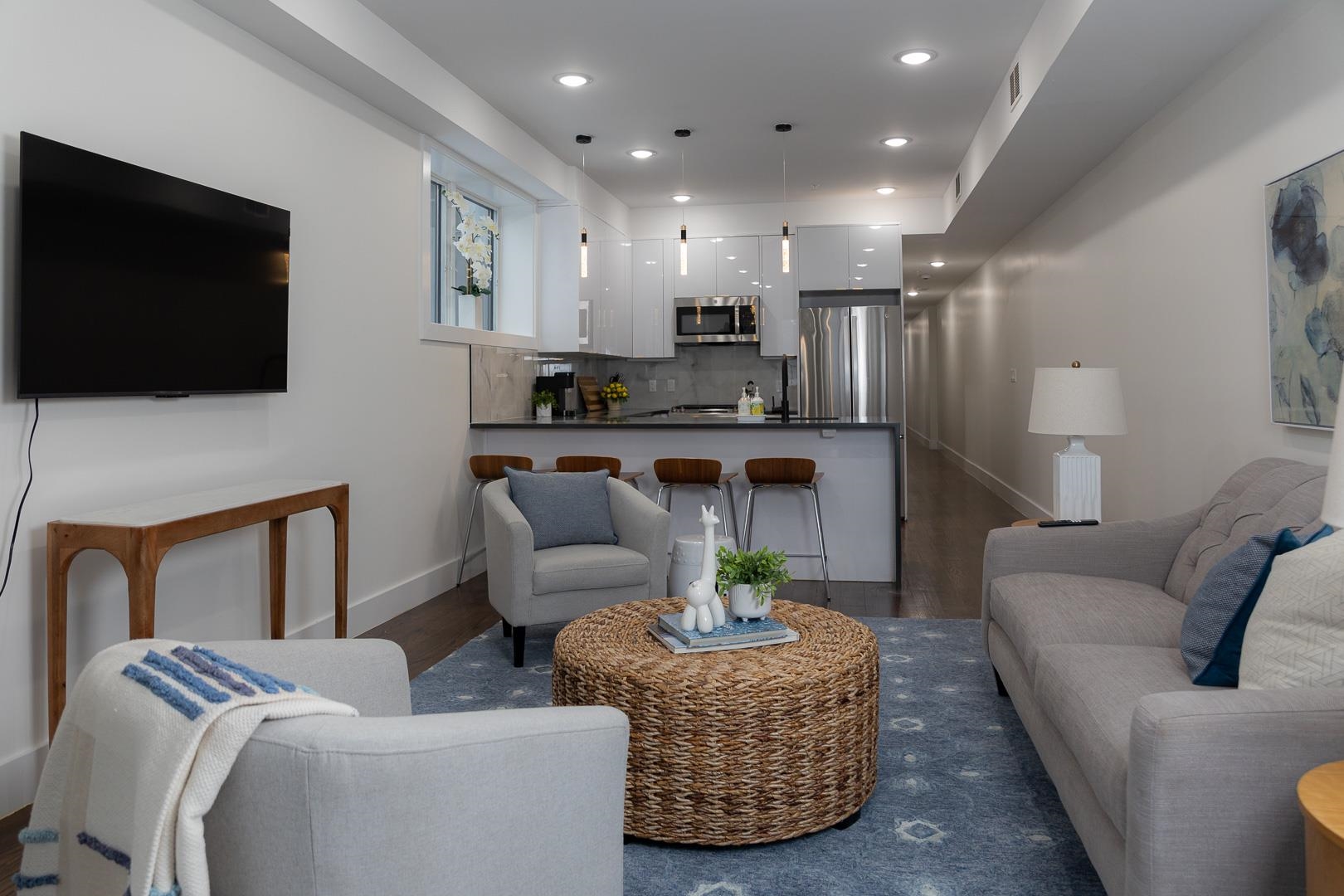 39 Boyd Avenue Jersey City, NJ 07304 - Photo 9 of 29 a living room with furniture and a flat screen tv