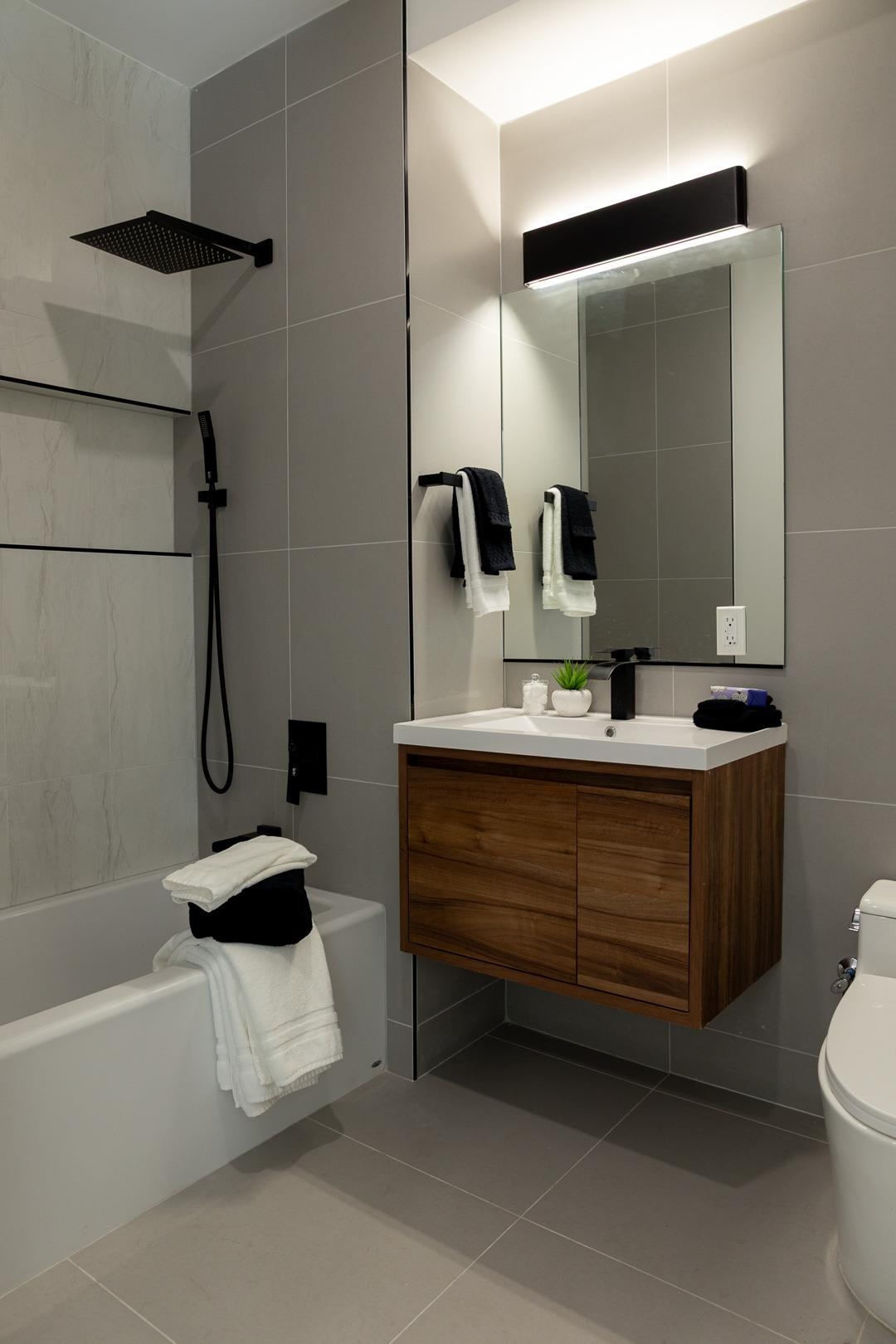 39 Boyd Avenue Jersey City, NJ 07304 - Photo 10 of 29 a bathroom with a sink a toilet and shower