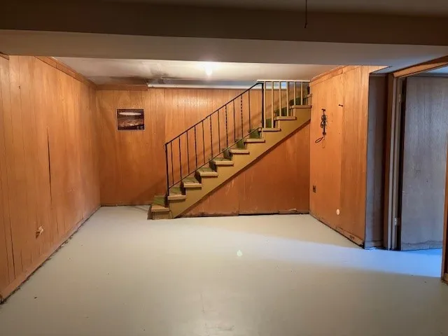 a view of an empty room with stairs