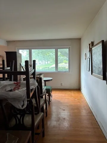 a view of a dining room with furniture and window