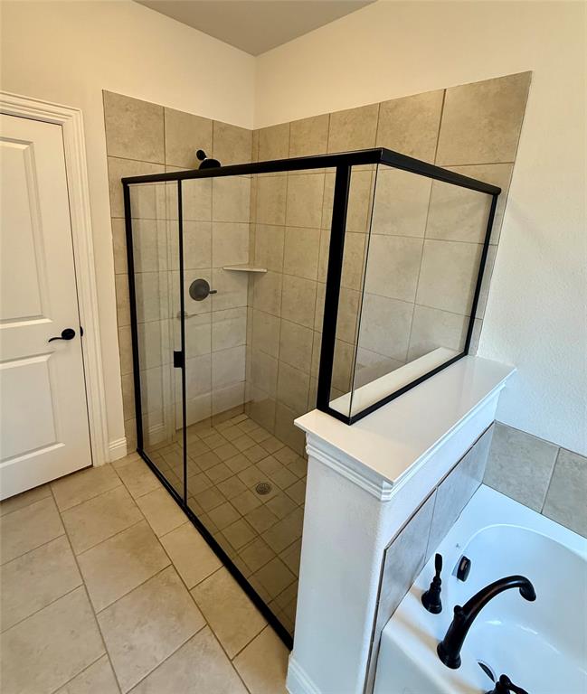 204 Flower Ridge Drive Fort Worth, TX 76108 - Photo 21 of 27 a bathroom with a shower and mirror
