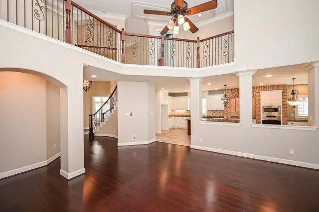 a view of an entryway with wooden floor