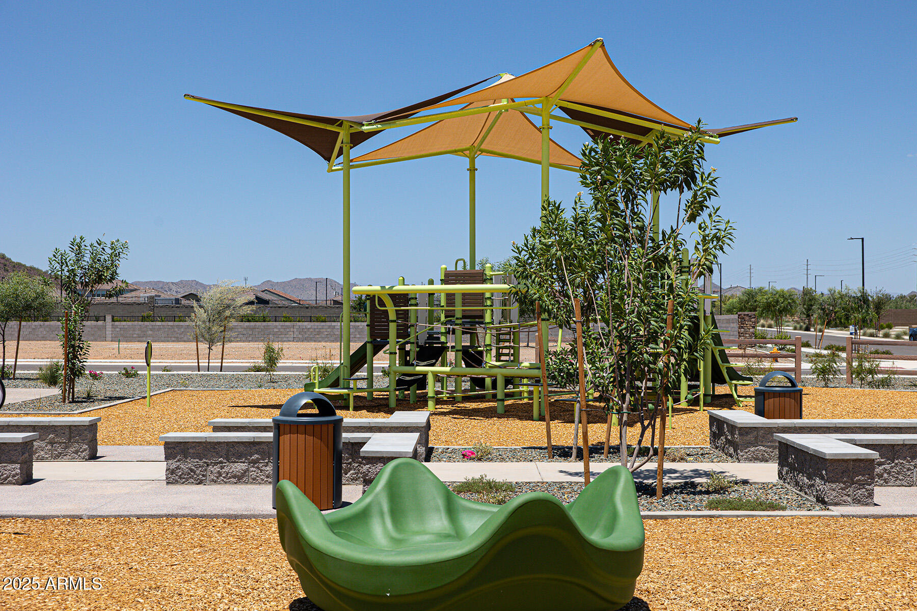 14856 West Briles Road Surprise, AZ 85387 - Photo 5 of 18 a view of a swimming pool with a lounge chairs