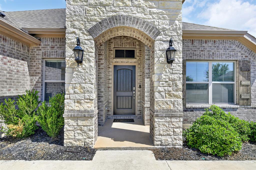 136 Gleeson Drive Red Oak, TX 75154 - Photo 5 of 40 a large stone building with a outdoor space