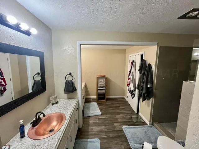 a bathroom with a sink and mirror