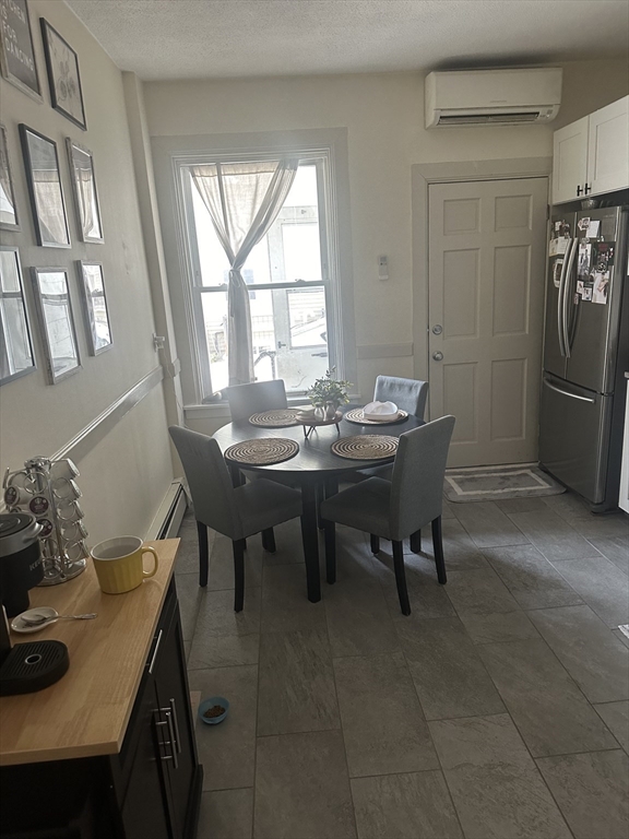 143 L Street, Unit 1 Boston, MA 02127 - Photo 5 of 11 a dining room with furniture and window