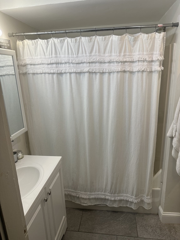 143 L Street, Unit 1 Boston, MA 02127 - Photo 8 of 11 a bathroom with a sink and a mirror