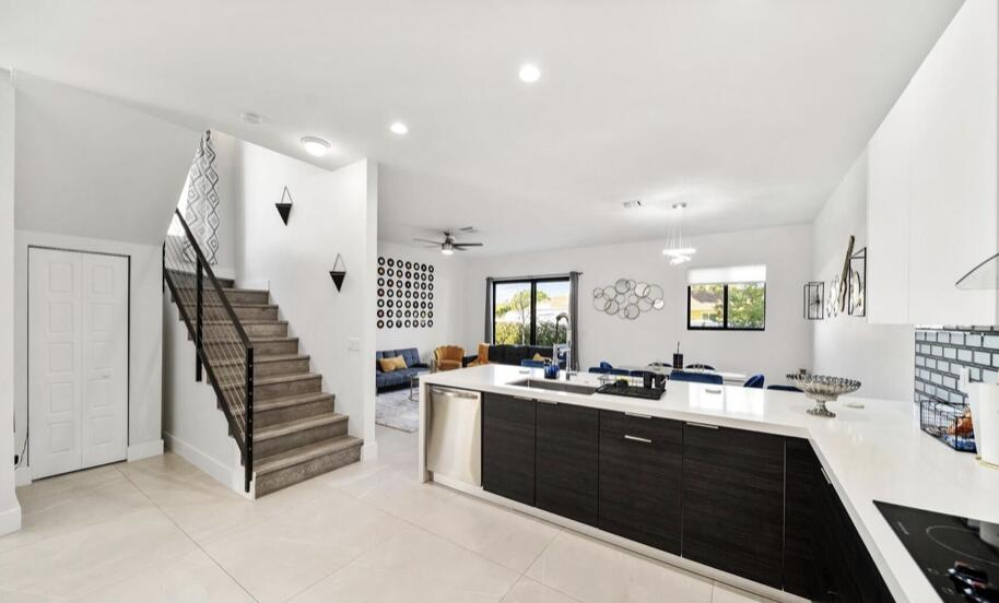 3254 Southwest 44th Street Fort Lauderdale, FL 33312 - Photo 11 of 26 a spacious bathroom with a double vanity sink toilet and a mirror