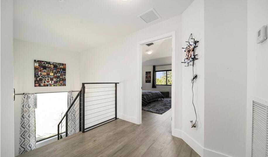 3254 Southwest 44th Street Fort Lauderdale, FL 33312 - Photo 22 of 26 a view of a hallway view with wooden floor and staircase