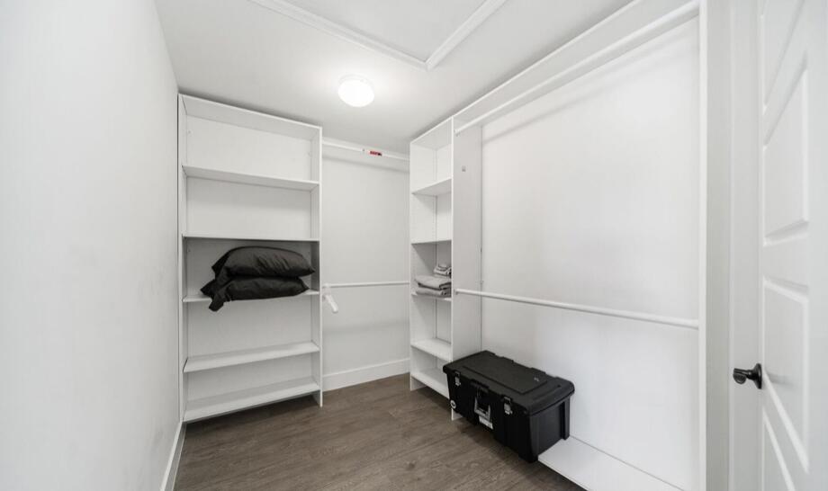 3254 Southwest 44th Street Fort Lauderdale, FL 33312 - Photo 24 of 26 a room with a walk in closet and wooden floor