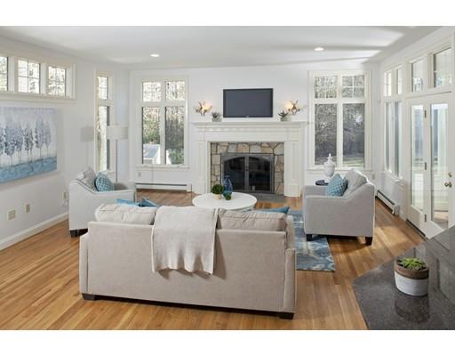 71 Bates Way Hanover, MA 02339 - Photo 8 of 30 a living room with furniture and a fireplace