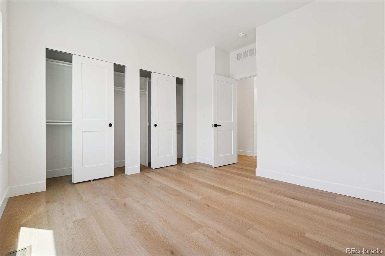 113 Mohawk Circle Superior, CO 80027 - Photo 24 of 50 a view of an empty room with wooden floor
