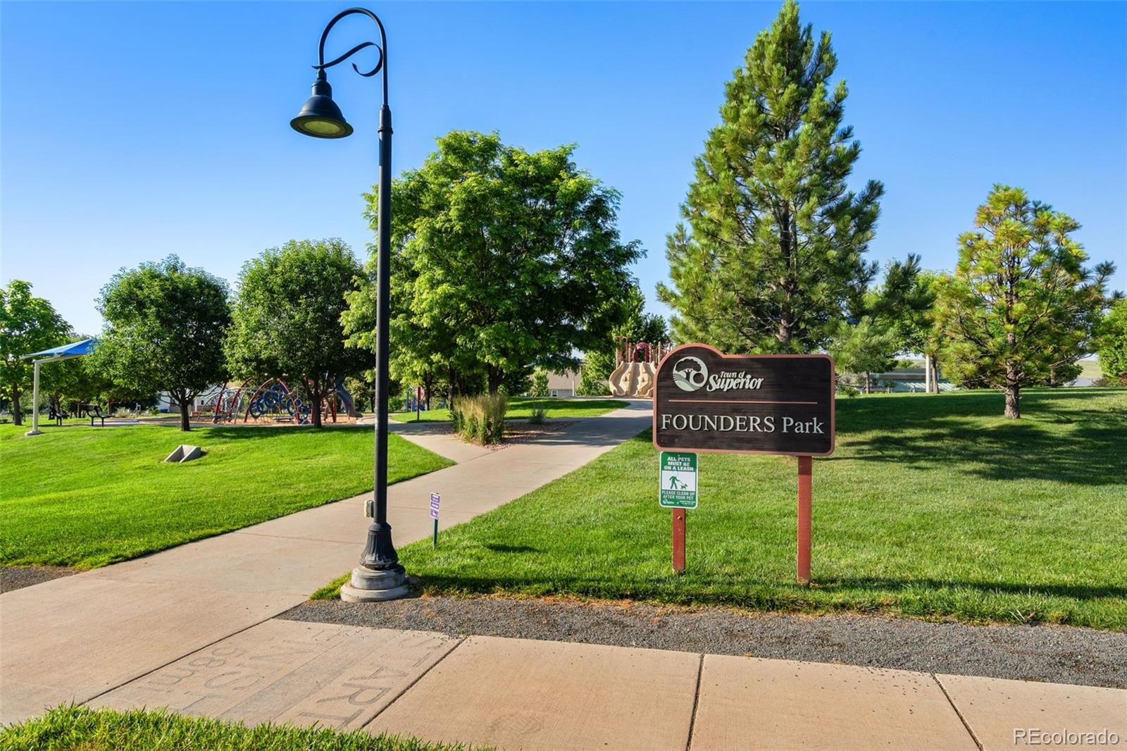 113 Mohawk Circle Superior, CO 80027 - Photo 37 of 50 a street sign on a side of a park