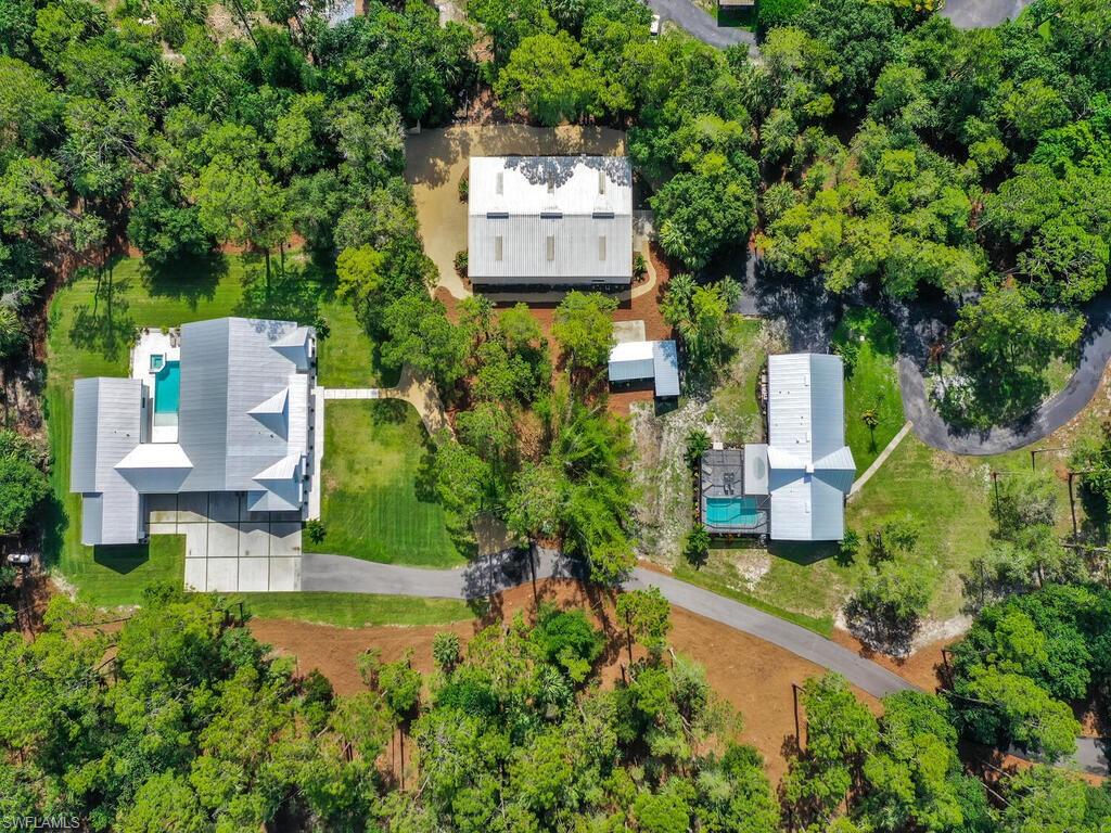 3475 3rd Avenue Southwest Naples, FL 34117 - Photo 1 of 49 an aerial view of a house with a garden