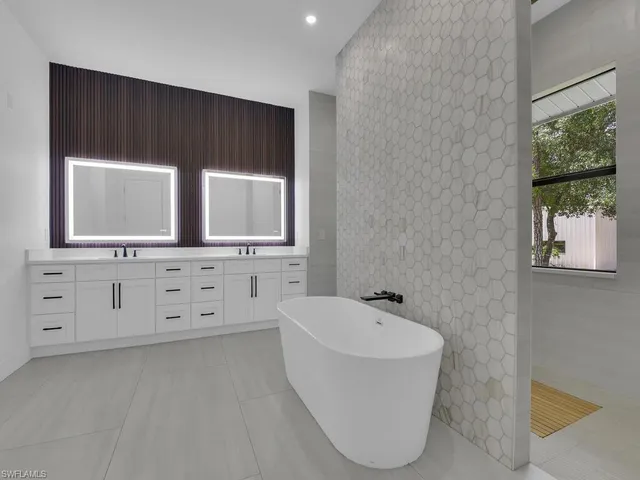 a kitchen with cabinets and wooden floor