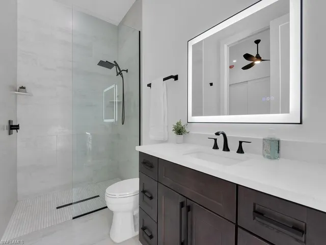 a view of a house with a backyard and a patio