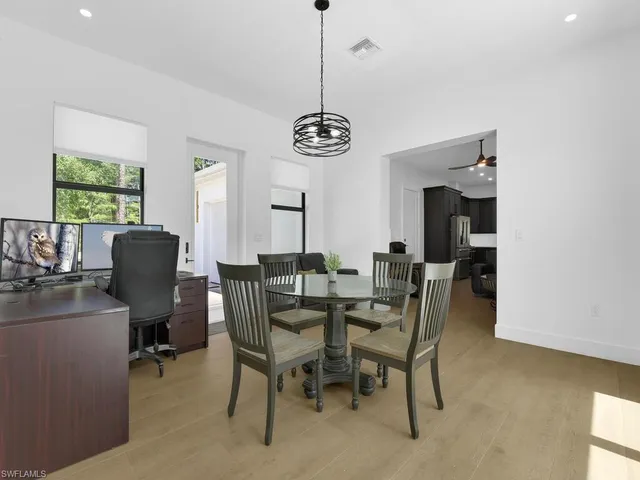 a kitchen with a sink cabinets and appliances