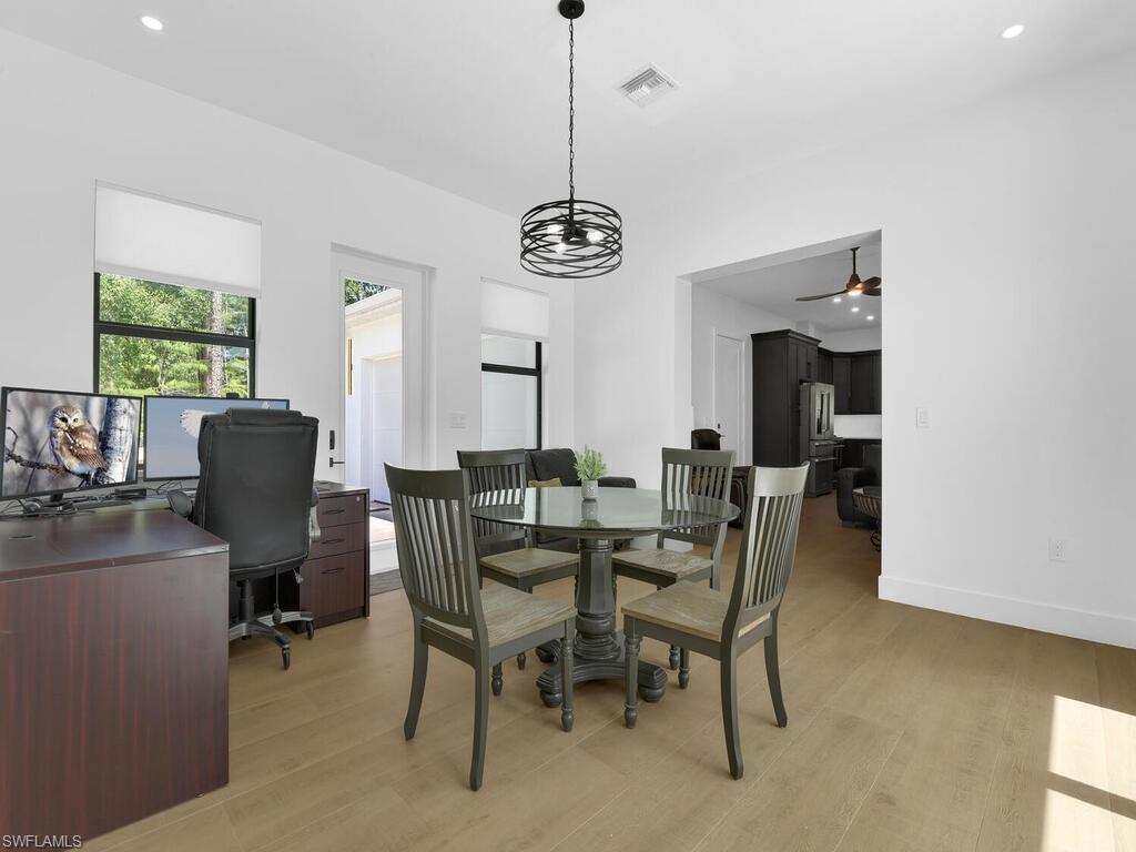 3475 3rd Avenue Southwest Naples, FL 34117 - Photo 29 of 49 a view of a dining room with furniture window and outside view