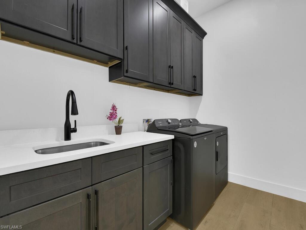 3475 3rd Avenue Southwest Naples, FL 34117 - Photo 30 of 49 a kitchen with a sink cabinets and appliances
