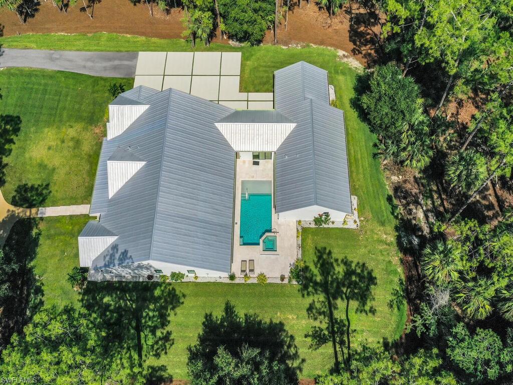 3475 3rd Avenue Southwest Naples, FL 34117 - Photo 3 of 49 an aerial view of a house with a yard and lake view