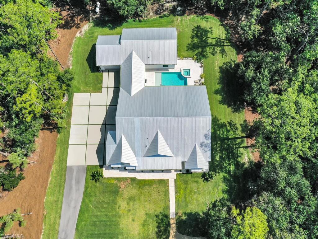 3475 3rd Avenue Southwest Naples, FL 34117 - Photo 33 of 49 an aerial view of residential houses with outdoor space and swimming pool