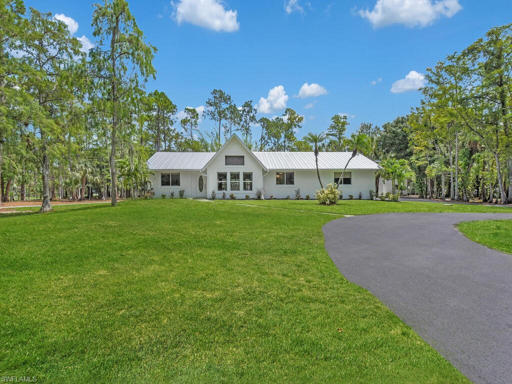 3475 3rd Avenue Southwest Naples, FL 34117 - Photo 34 of 49 a view of a house with a big yard