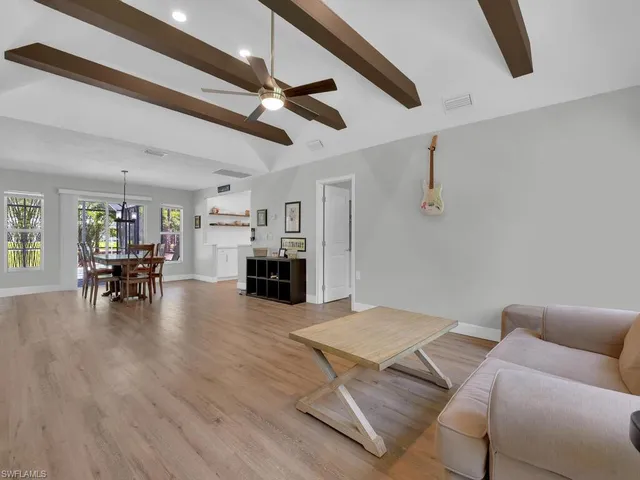 a dining room with furniture and window