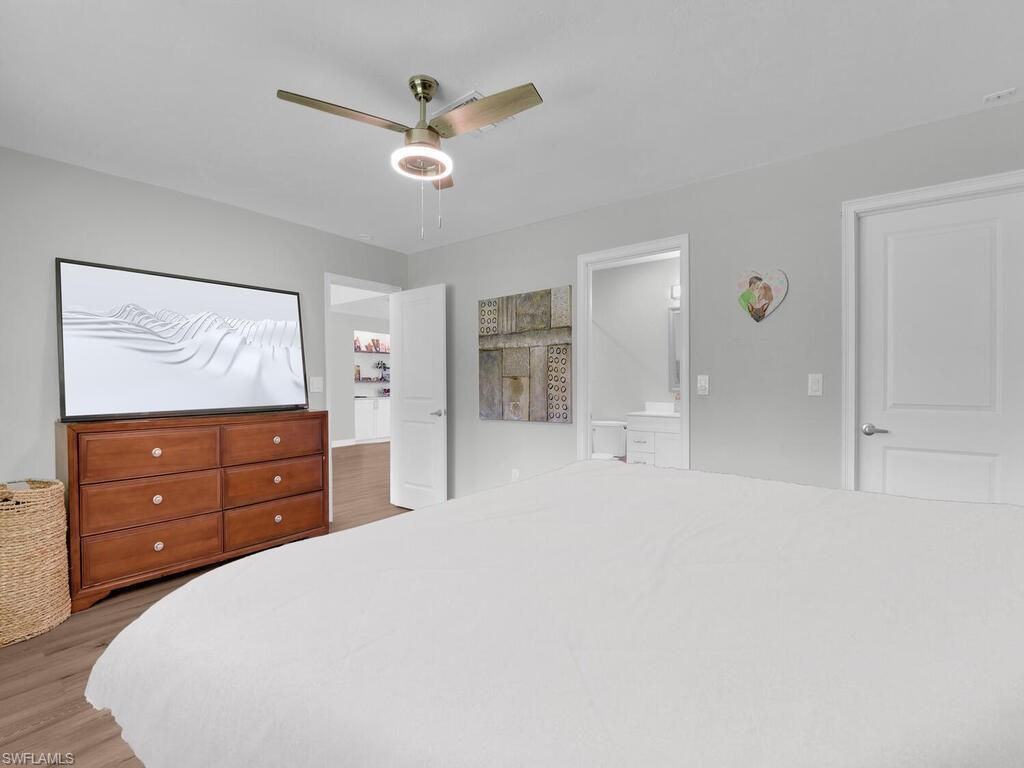 3475 3rd Avenue Southwest Naples, FL 34117 - Photo 40 of 49 a bedroom with a bed and a dresser